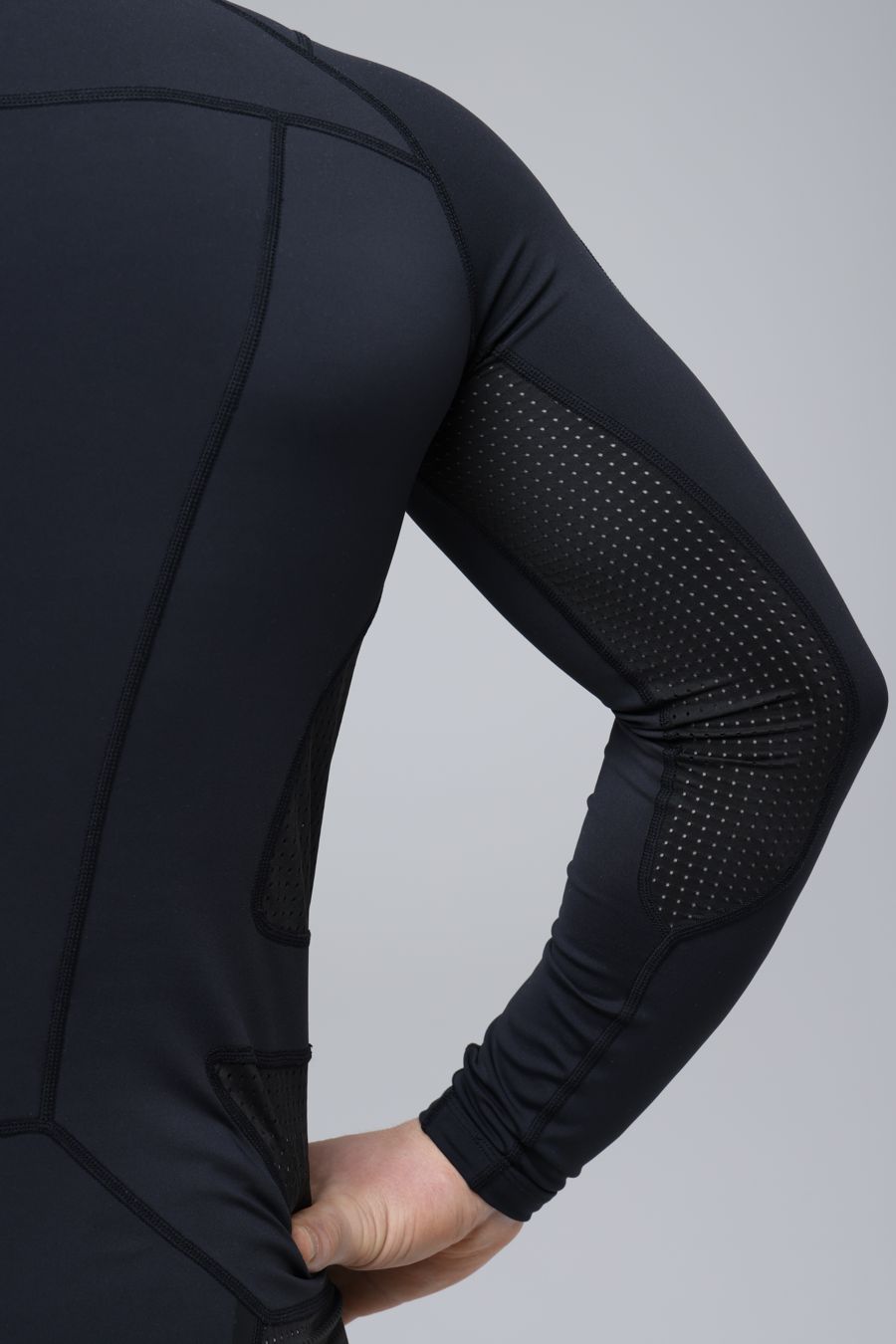Long sleeve with mesh inserts, hand on hip