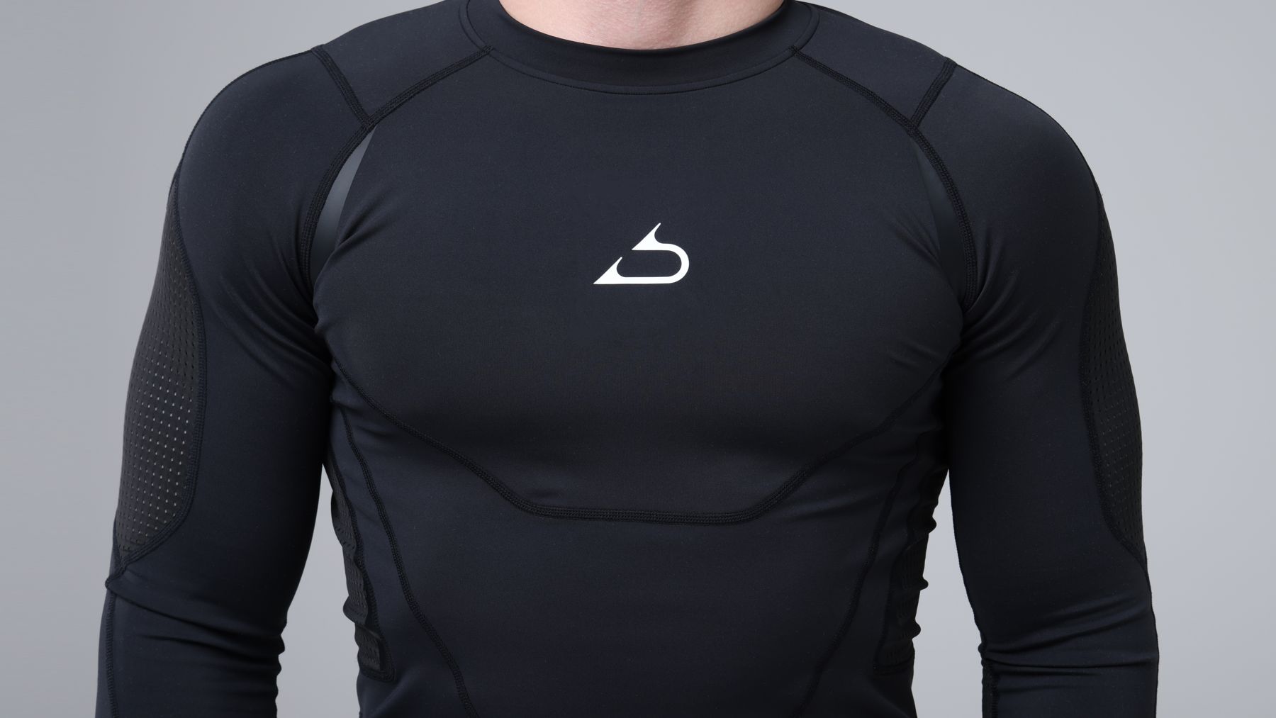 Athlete in an Abjari long sleeve, hands raised in a grappling stance