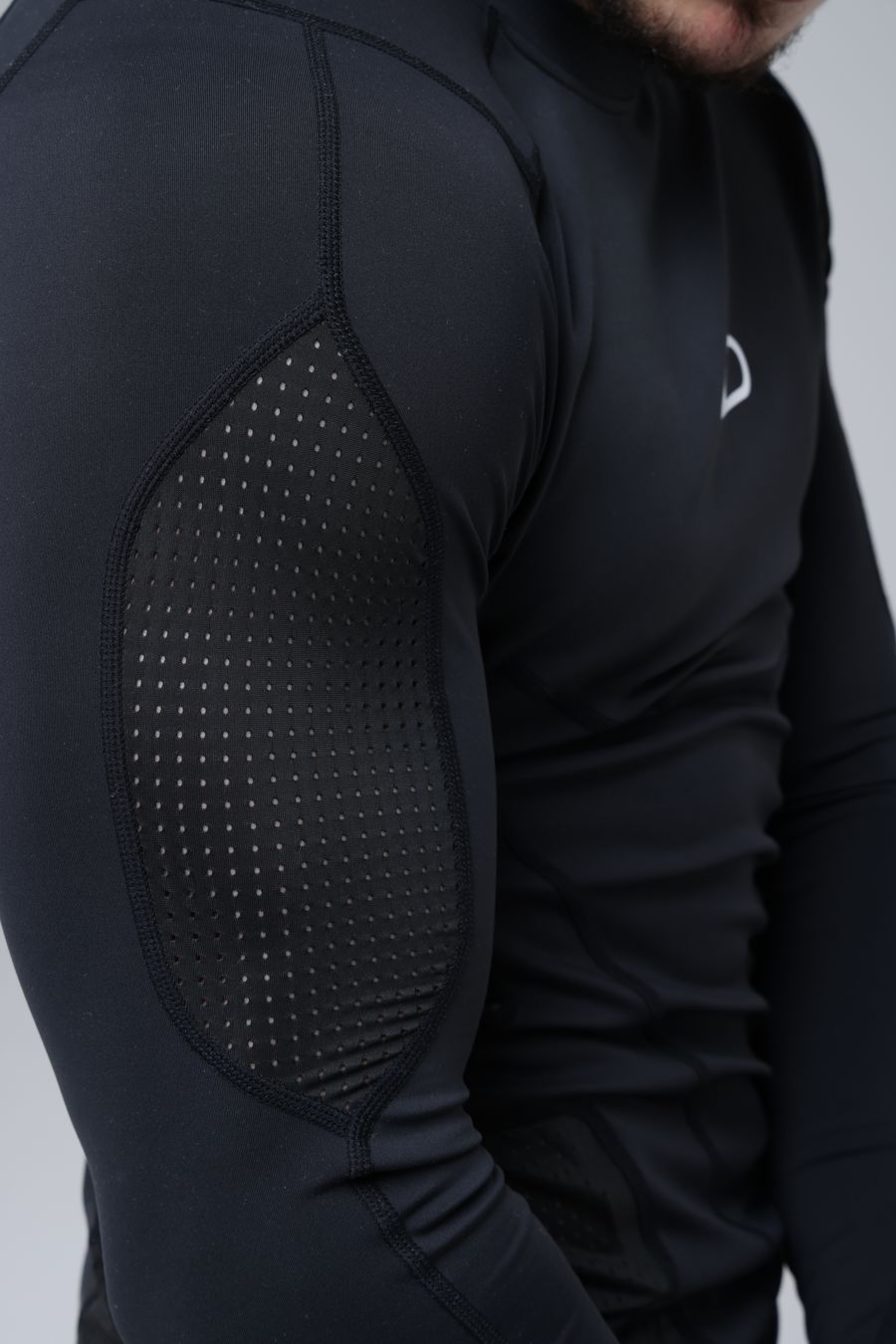 Side profile of an athlete in an Abjari rash guard