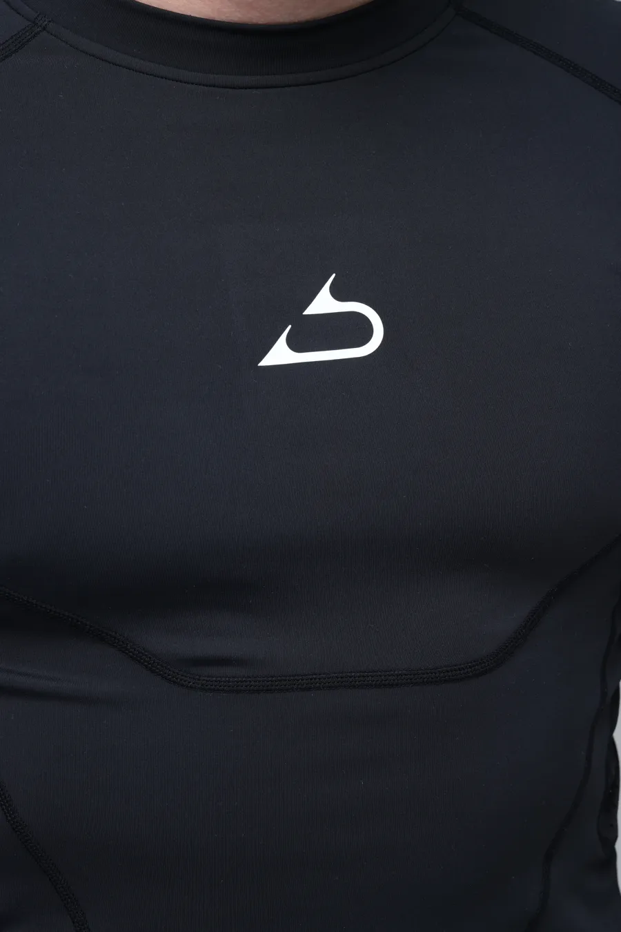 Logo printed on the chest of a compression top